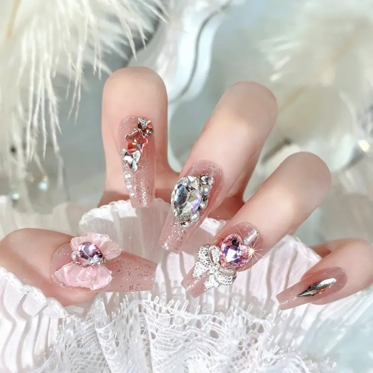3D pink bow and heart rhinestone decoration on nude pink press-on nail