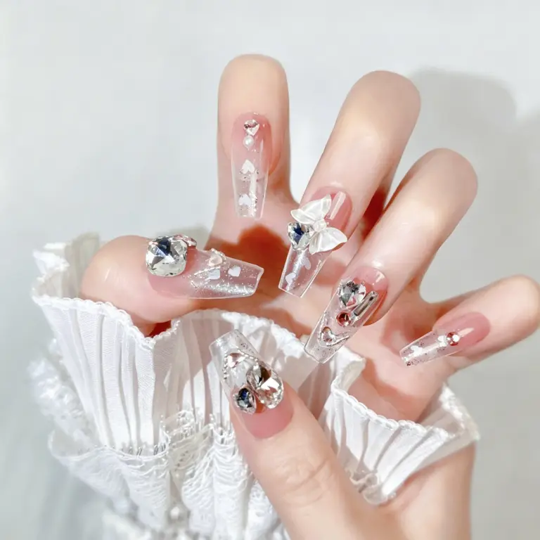 Elegant clear glitter long coffin press-on nails with bows on hand
