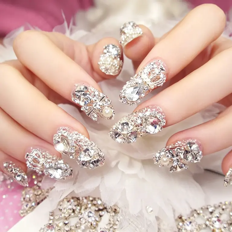 Close-up of large crystal cluster on silver glitter press-on nail
