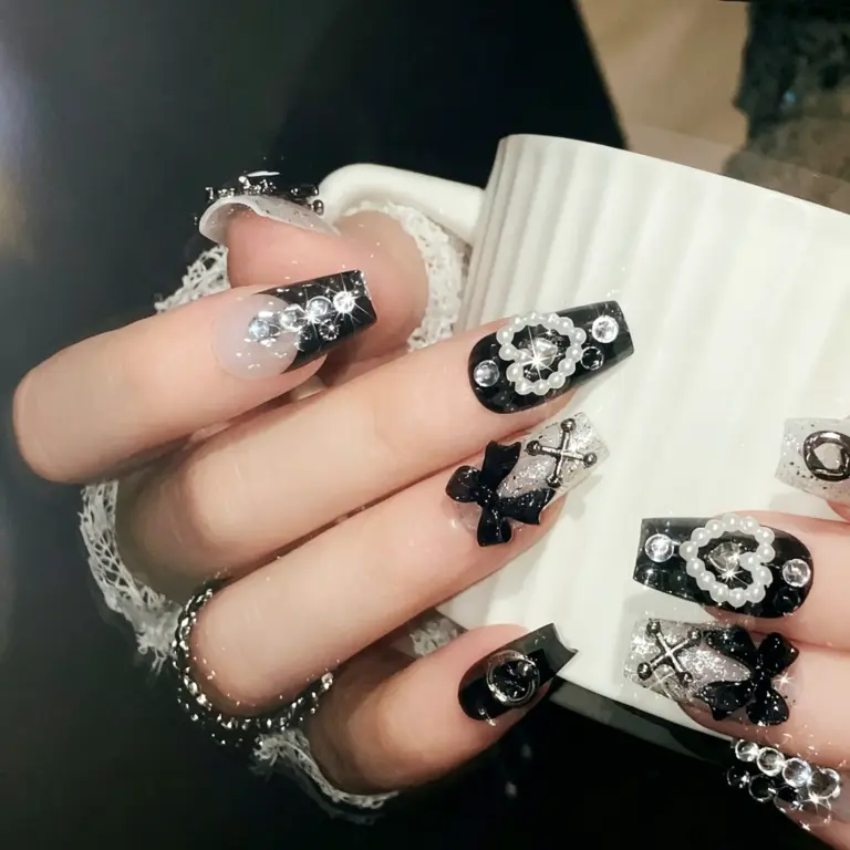 Detailed view of cute dark character charm on silver glitter press-on nail