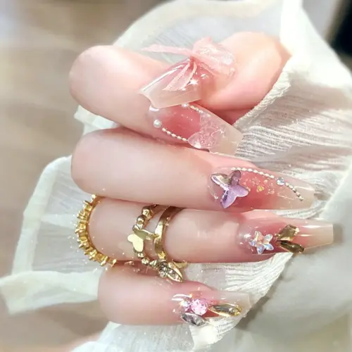 Iridescent Butterfly Charm Detail on Blush Pink Press On Nail