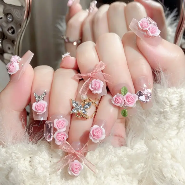 Detailed view of 3D gradient pink rose cluster on press-on nail