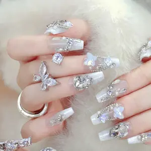 Detailed View Of Sparkling Rhinestones And Butterflies On White Press On Nails