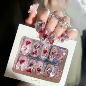 Detailed View Of Sparkling Heart Rhinestones On Pink Glitter Press On Nails