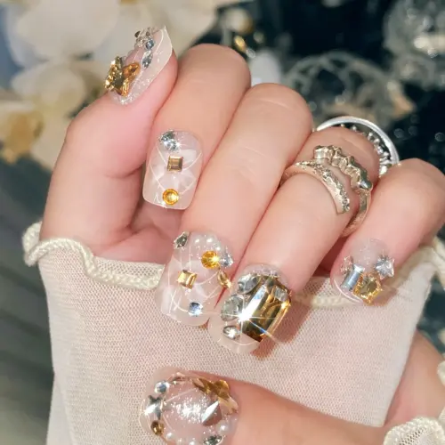 Pearl And Star Accents On Luxurious Gold Silver Nails