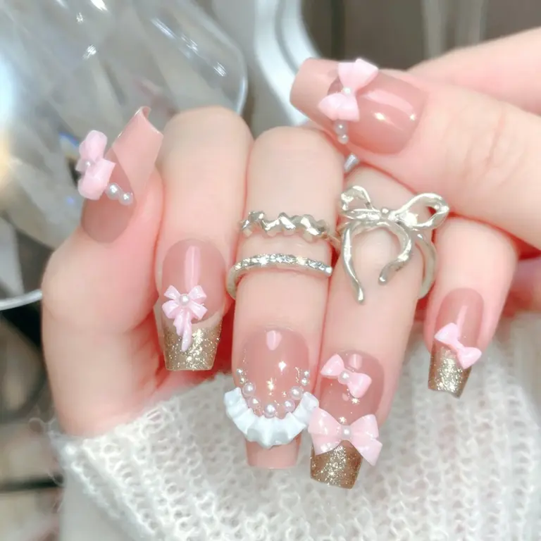 3D pink bow and pearl details on nude pink press on nails