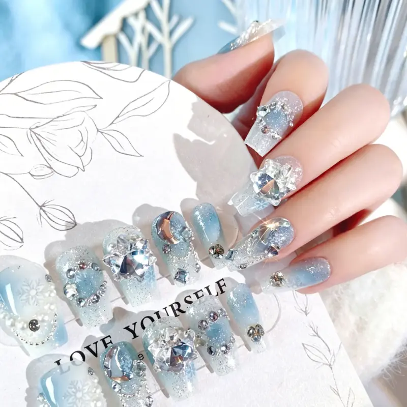 Flat Lay of Christmas Snowflake Rhinestone Press On Nails Full Set