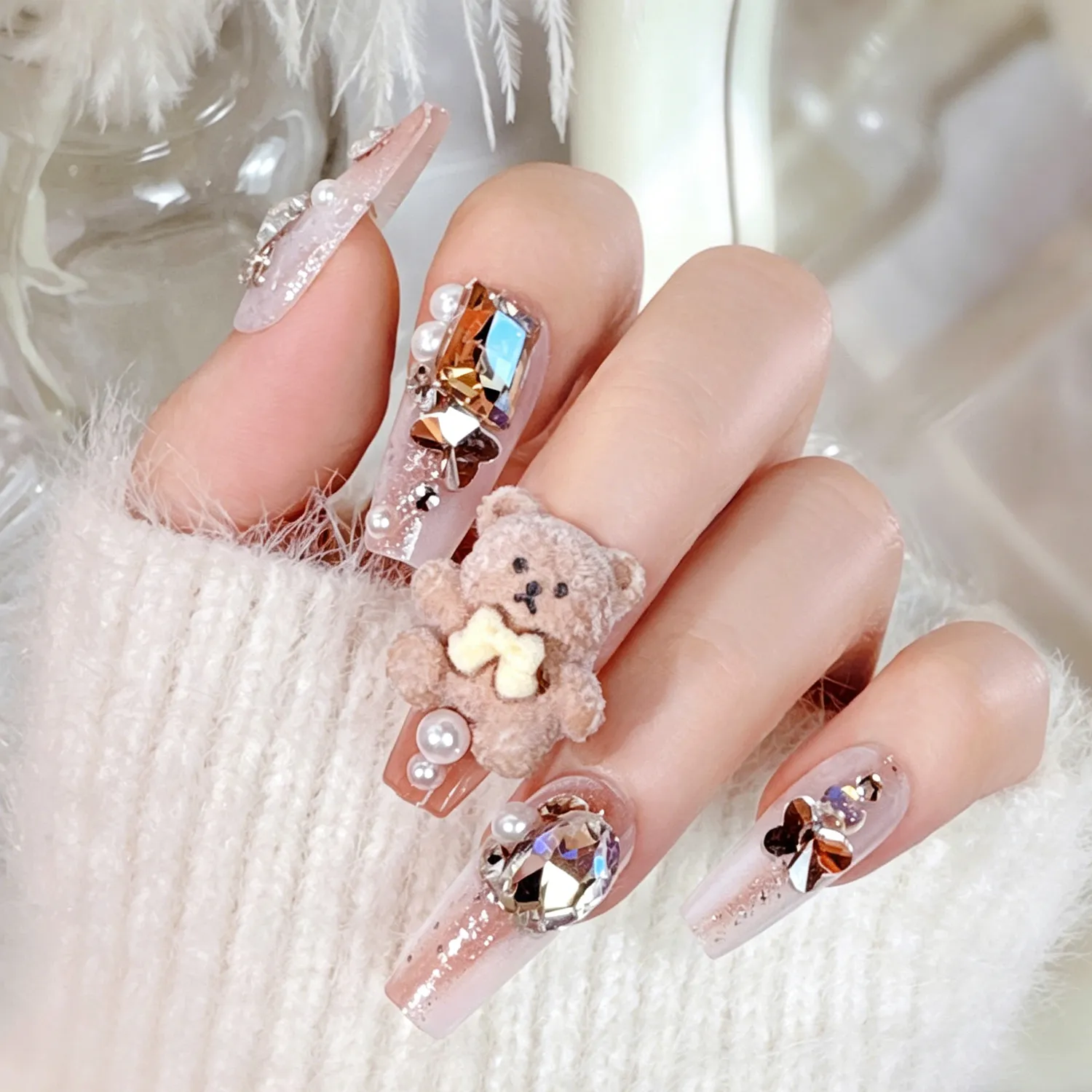 Close-up of cute fluffy bear design on press-on nail