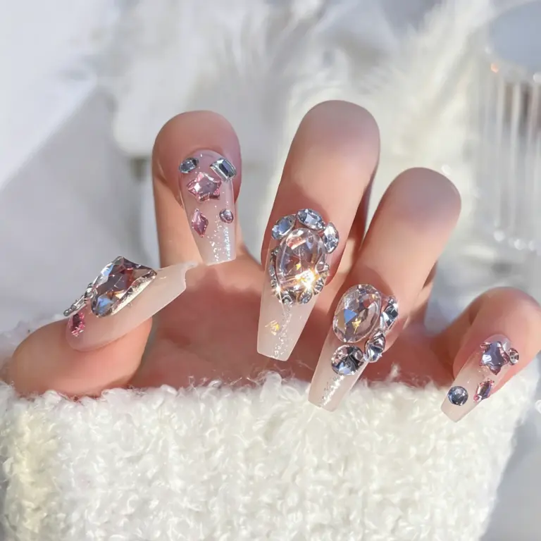 24-piece shiny rhinestone nail set flat lay, large gems, full size